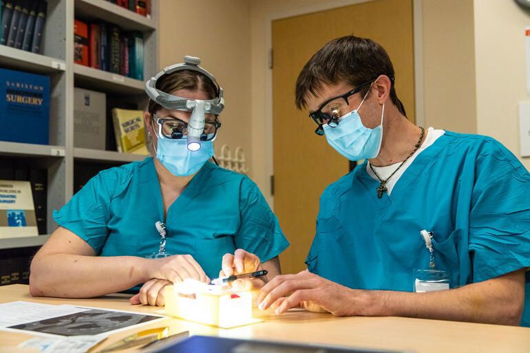 Kaalan Johnson, MD working with 3D printed airway.