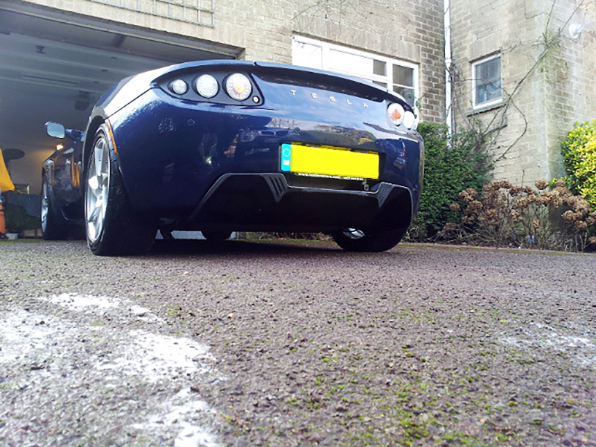 Dash CAE 3D printed diffuser floor, seen on a Tesla underneath the license plate, on its Fortus 400mc Production System.