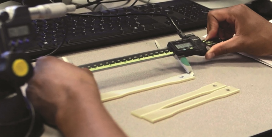 pair of hands working with heat treated FDM material