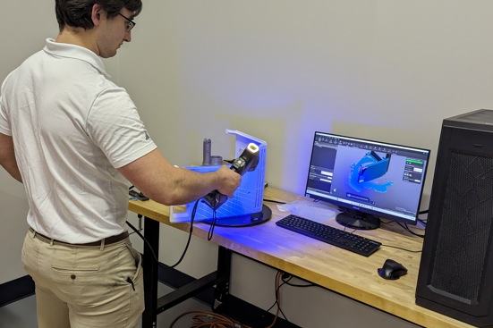 Additive American Manufacturing Employee with Printer