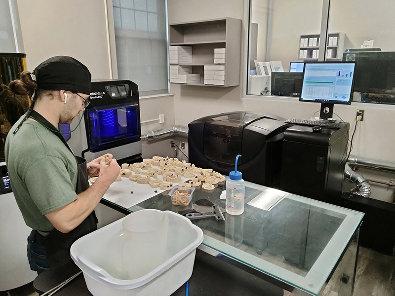 dental lab technician working 3d printed  dental models