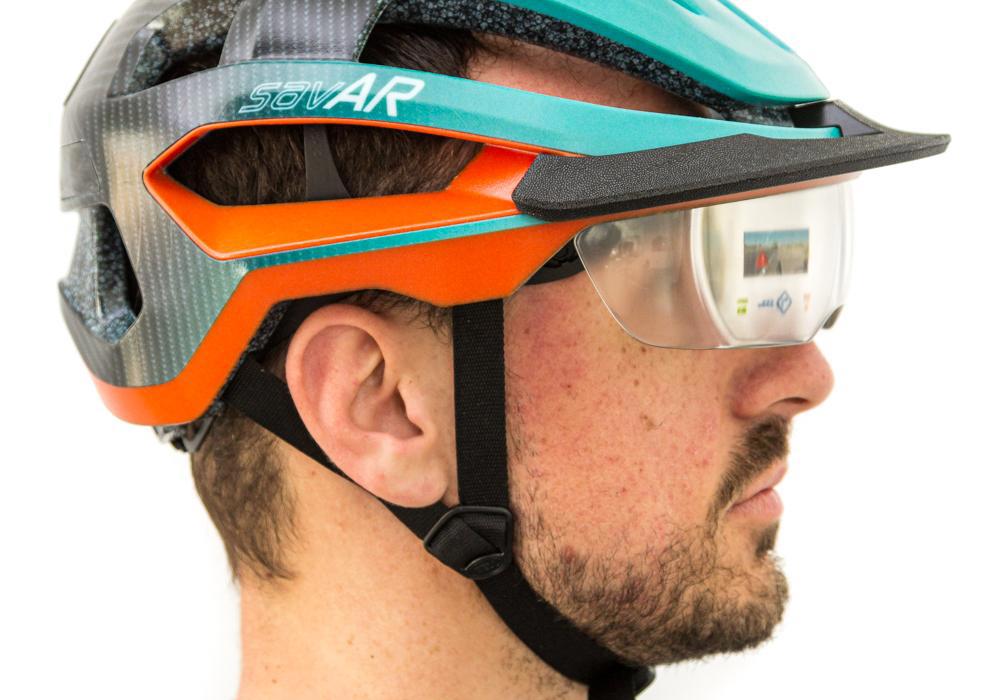 Model of a bicycle helmet, including complex AR technology within the see-through visor, as well as indicator lights and striking design textures – 3D printed by Thinkable Studio on the J55