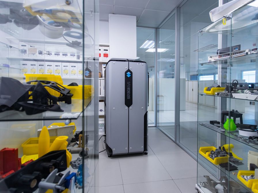 Stratasys F370 printer in office with parts.