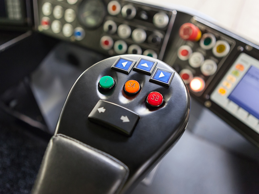 3D printed armrest with three extra buttons for the control system.