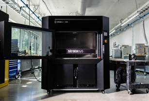Stratasys F870 FDM 3D printer with chamber door open.
