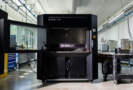 Stratasys F870 FDM 3D printer with chamber door open.
