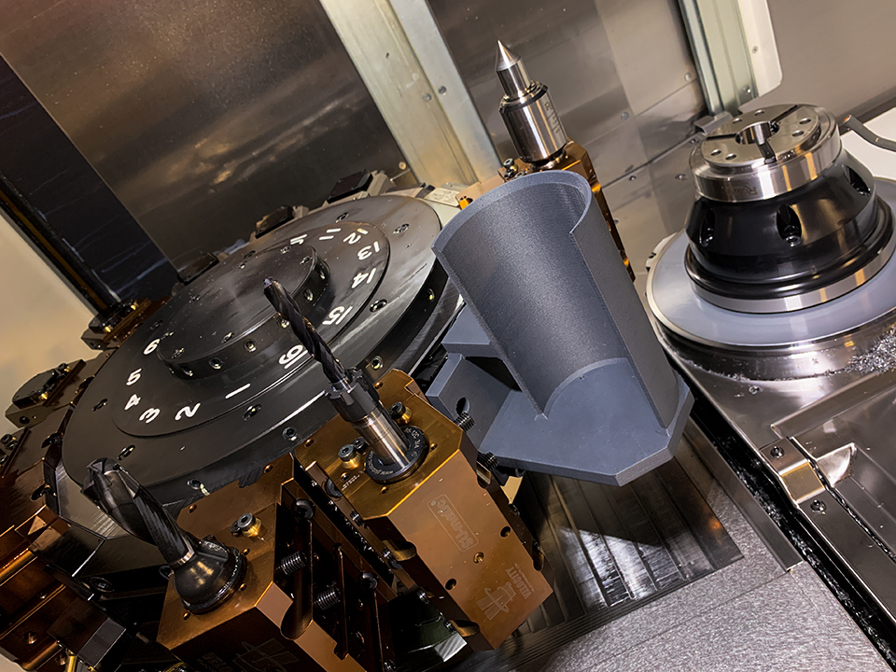 The 3D printed part catcher (gray) is attached to the lathe’s lower turret.